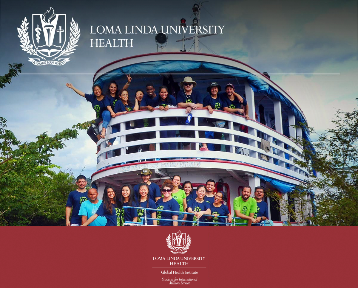 white ship with a lot of SIMS students posing on it