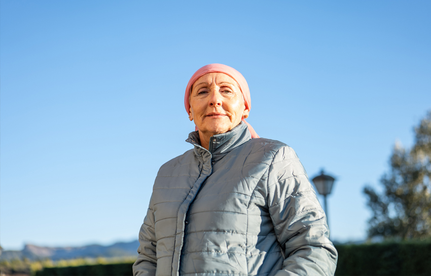 Senior Caucasian Woman With Jacket And Pink Headscarf Cancer And Optimism 