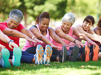 Women Exercising in a Park