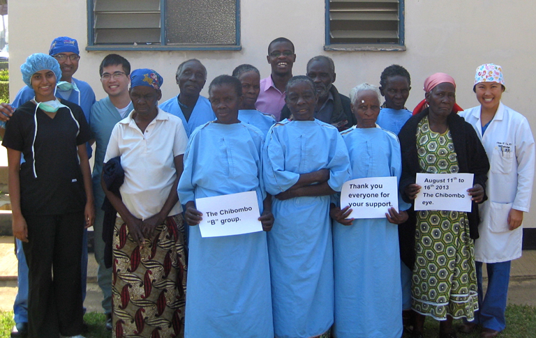 Students and providers posing with patients