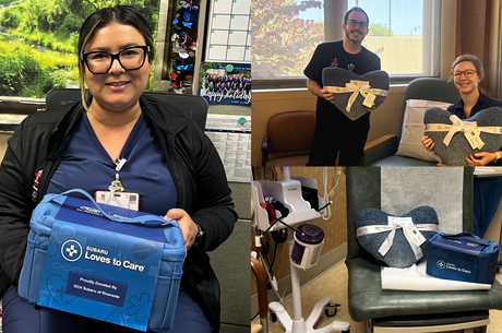 a healthcare team holds blankets and care kits