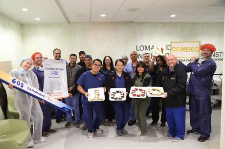 a group of medical employees pose for a photo