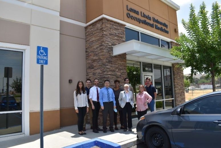 Occupational & Environmental Medicine Residency faculty & residents photo outside OEM office