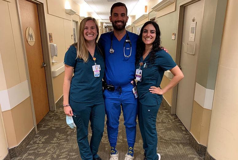 3 residents posing at a weekend on call