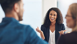 lady speaking with hands up