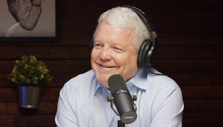 Dr. Donaldson speaking into microphone