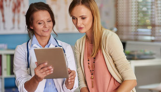 female doctor with female patient