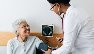 female doctor with senior patient