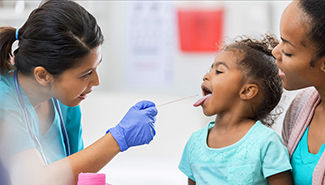 child being examined at urgent care center
