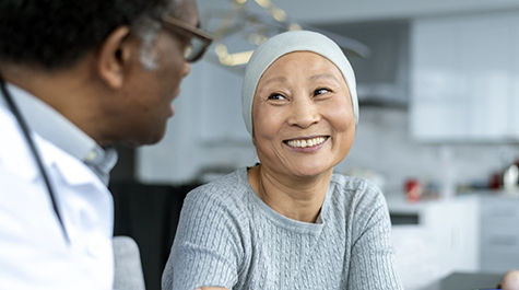 Cancer patient looking at physician