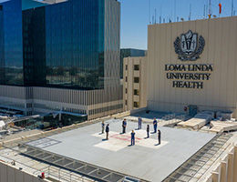 Hospital staff have moment of prayer atop hospital helipad