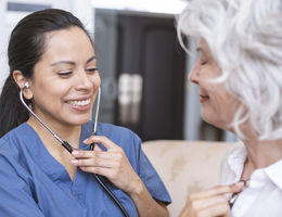 Physician checking patients with a stethoscope