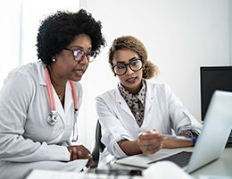 female doctors working on a computer together