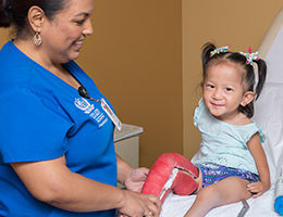 doctor measuring a child's leg