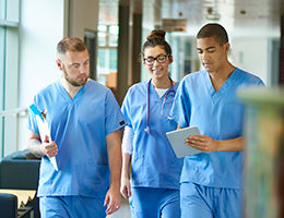 medical team walking together inside hospital