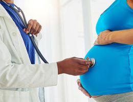 Obstetrics doctor providing care to pregnant woman