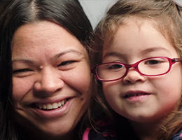 mother and daughter smiling for the camera