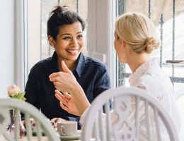 Two women gathered together at a table