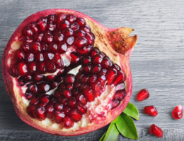 pomegranate seeds in sliced open pomegranate 