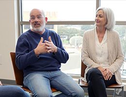 man and woman conversing in a support group