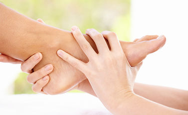 doctor examining someones foot for nerve damage