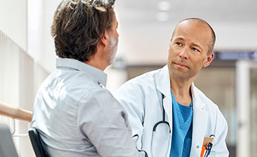 Male patient being examined by a doctor