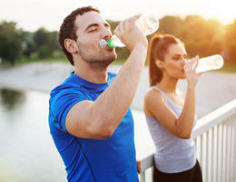 Couple drinking water after a run