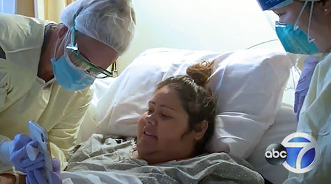 doctor and patient viewing baby on phone
