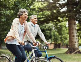 Couple riding bikes outdoors