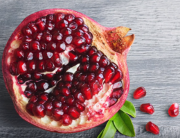 pomegranate seeds in sliced open pomegranate